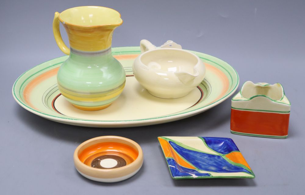 Four pieces of Clarice Cliff, a Shelley jug and one other
